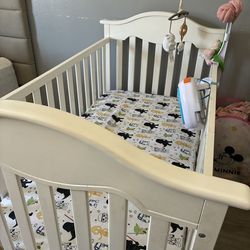 Baby crib, changing table and bedding sheets