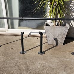 Wall mounted pipe clothes rack