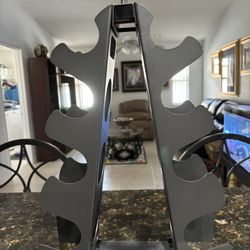 New dumbbell rack stand. black metal. 12”W x 16”H. holds 5-15 pound weights  