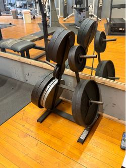 12 Weight PlatesToral 325 lbs. * 5 Peg Olympic Weight Plates Tree