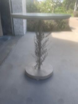 Metal side table with leaf detail