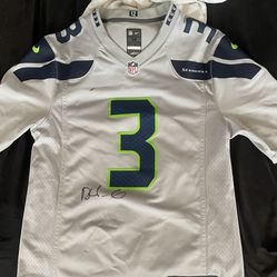 Russell Wilson jersey signed by KJ Wright
