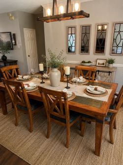 Solid wood, rustic oak dining table set with slate top inserts and matching X back chairs