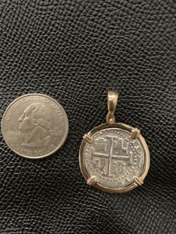 Atocha silver coin pendant in gold bezel