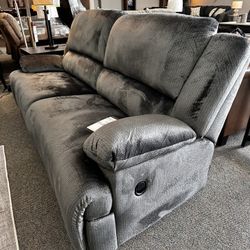 $39 Down with Easy Financing or $799 will get this brand new Ashley Clonmel Manuel Reclining Sofa.  Fast delivery Easy financing: no credit + zero int
