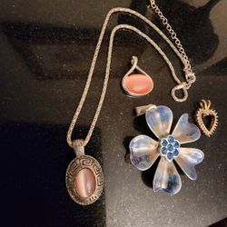 4 Pendants And A Silver Toned Chain
