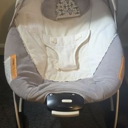 Graco rocking chair, Simmons crib, and Ergobaby baby carrier, all in good condition.