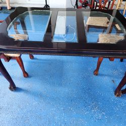 dining wooden table with glass top and 6 chairs