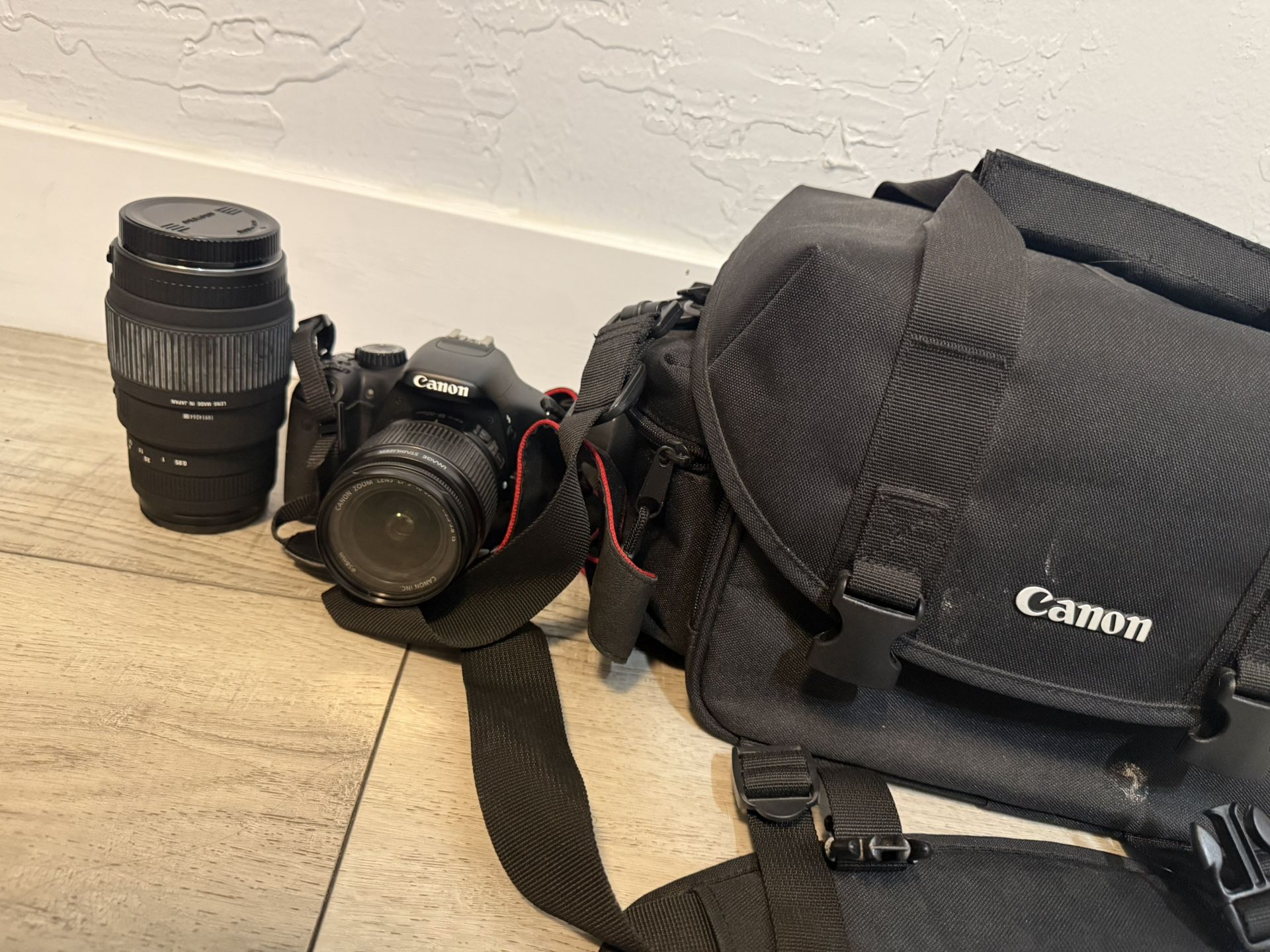 Canon EOS 550D (Rebel T2i) DSLR camera bundle. Includes the 18-55mm kit lens (perfect for everyday shooting) and a Sigma 70-300mm f/4-5.6 DG telephoto