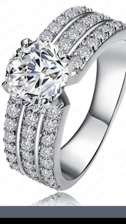 Brilliant cubic zirconia and sterling silver stamped 925 ladies ring size 6,8.