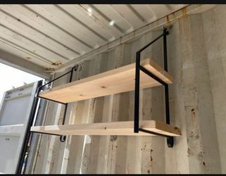 Shipping container shelving brackets