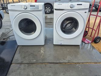 White Samsung washer and gas dryer set