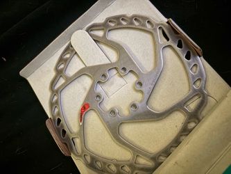Read Description. Shimano deore 2 piston caliper, brake pads, and brake rotor. All used but works fine