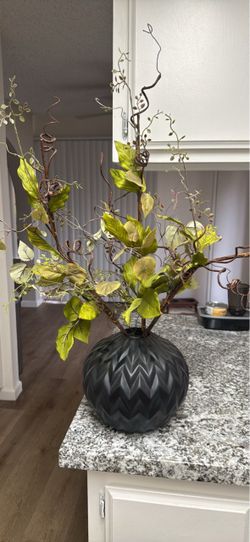 Black vase with faux stems