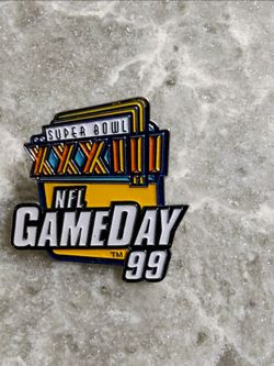 Peter David Super Bowl XXXIII Lapel Pin. This officially licensed NFL GAMEDAY 99 Football Hat Pin features the iconic Denver Broncos team logo