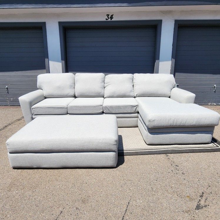 Grey Living Spaces Sectional Couch with Ottoman 