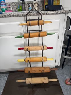 Antique rolling pins and iron rack.