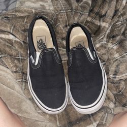 black and white slip on vans 