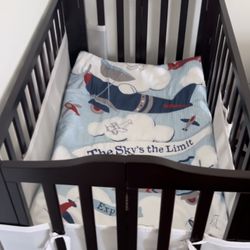 Delta Children Folding Portable Mini Baby Crib with 1.5-inch Mattress, Dark Chocolate