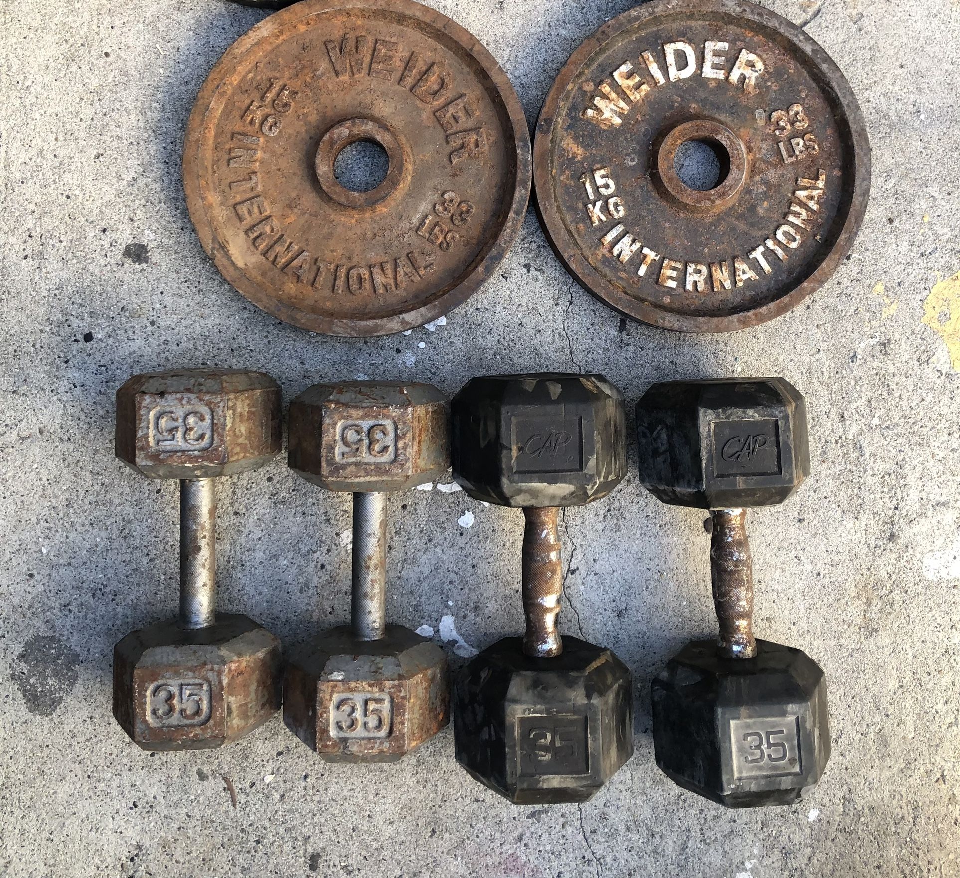 Olympic Weights Rusty But In Solid Condition Workout Equipment $50 Each Pair Or All Of Them For $140 firm price
