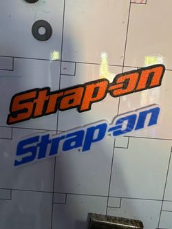 Magnetic strap on emblem