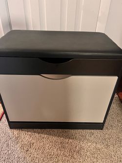 Shoe storage bench with padded seat, cushion, and flipped drawer Shoe storage bench with padded seat, cushion, and flipped drawer