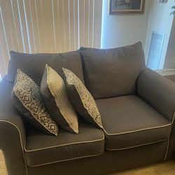 Charcoal Gray Loveseat with Accent Pillows