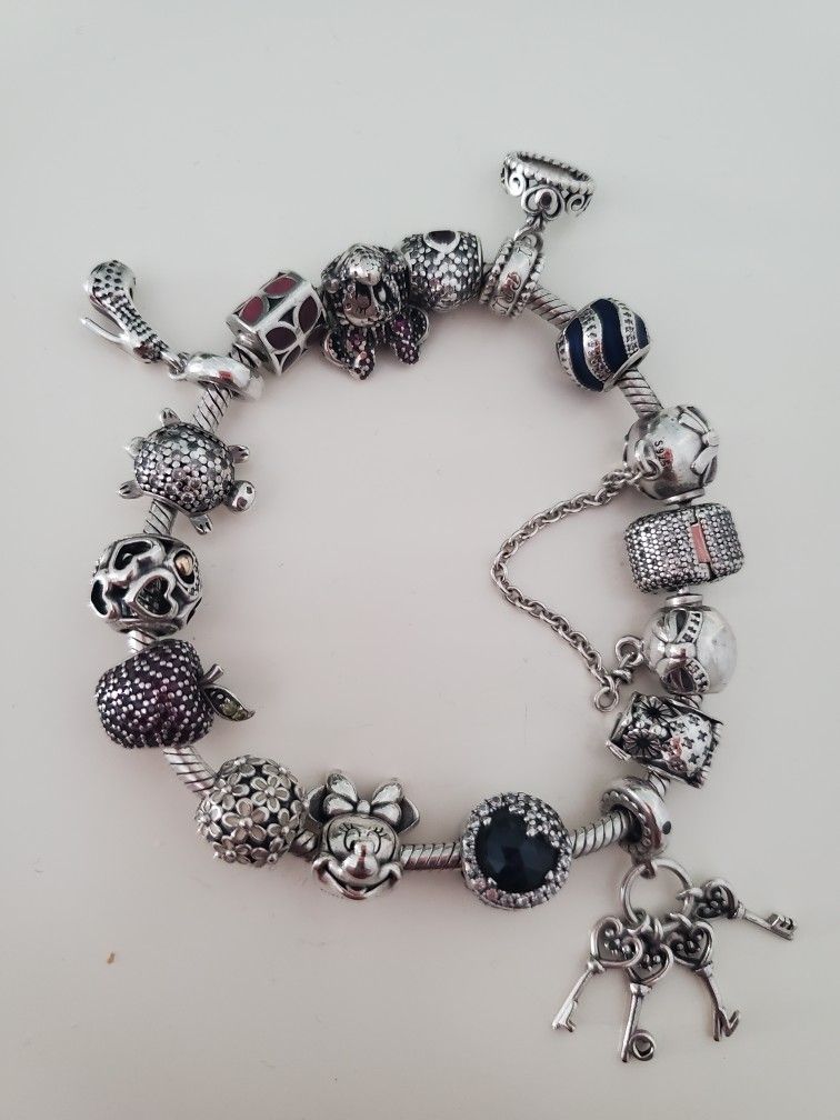 Pandora BRACELET WITH 16 CHARMS For $375 OBO