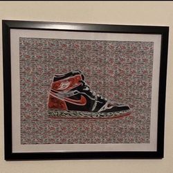 Custom art piece of red and black retro nike air Jordan 1 in black frmae