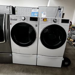 LG WASHER AND GAS DRYER W PEDESTALS