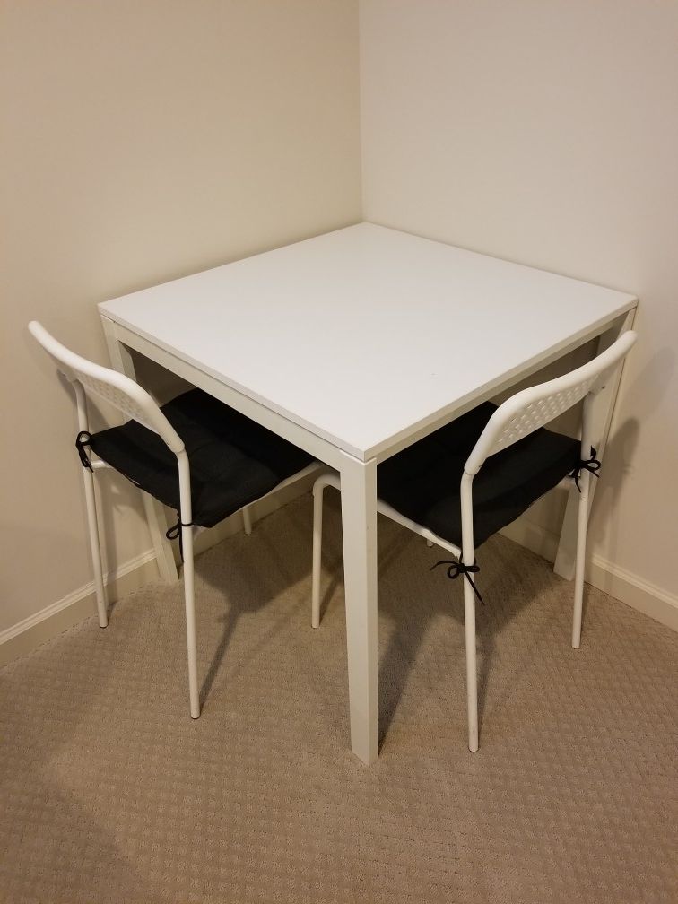 White square table with 2 chairs