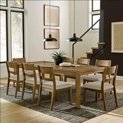 New Clayton Dining Table and 8 Chairs. Sells at Costco for $2000 plus tax.