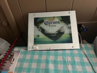 Corona mirrored sign lights up and gives sounds of water