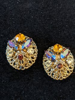 $15. Vintage antique rhinestone gold plated clip earrings made in West Germany. 1 in long and 3/4 in wide.