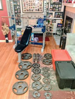 275 lb Olympic weights,barbell,dumbells,adjustable bench rack