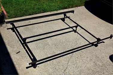 Adjustable Metal Bedframe with Center Support Bar and Casters.