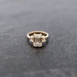 3 carat emerald cut lab grown diamond ring.