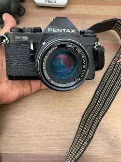 Vintage  Pentax MG 35 mm film camera with a 50mm lens