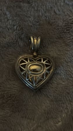 JCM Metropolitan heart pendant stamped with 14K gold and 925 sterling silver.