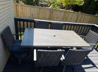 outdoor table and 6 swivel chairs