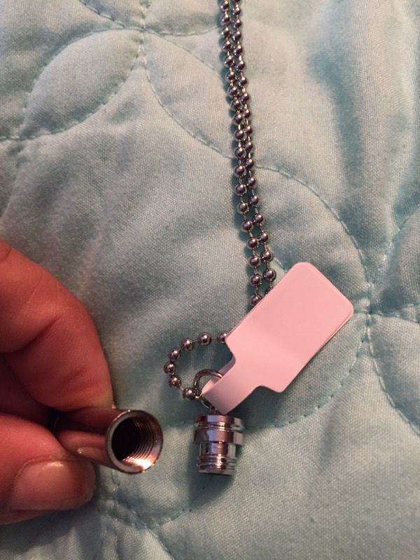 Bullet pendant with hidden compartment