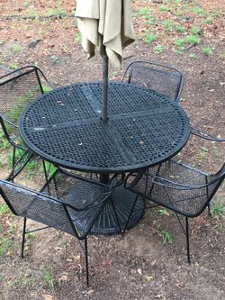Iron patio set and 4 chairs