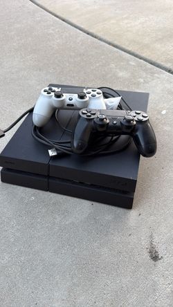 Sony PlayStation 4 Console with Two Controllers