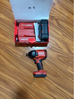 Hilt impact gun/battery charger