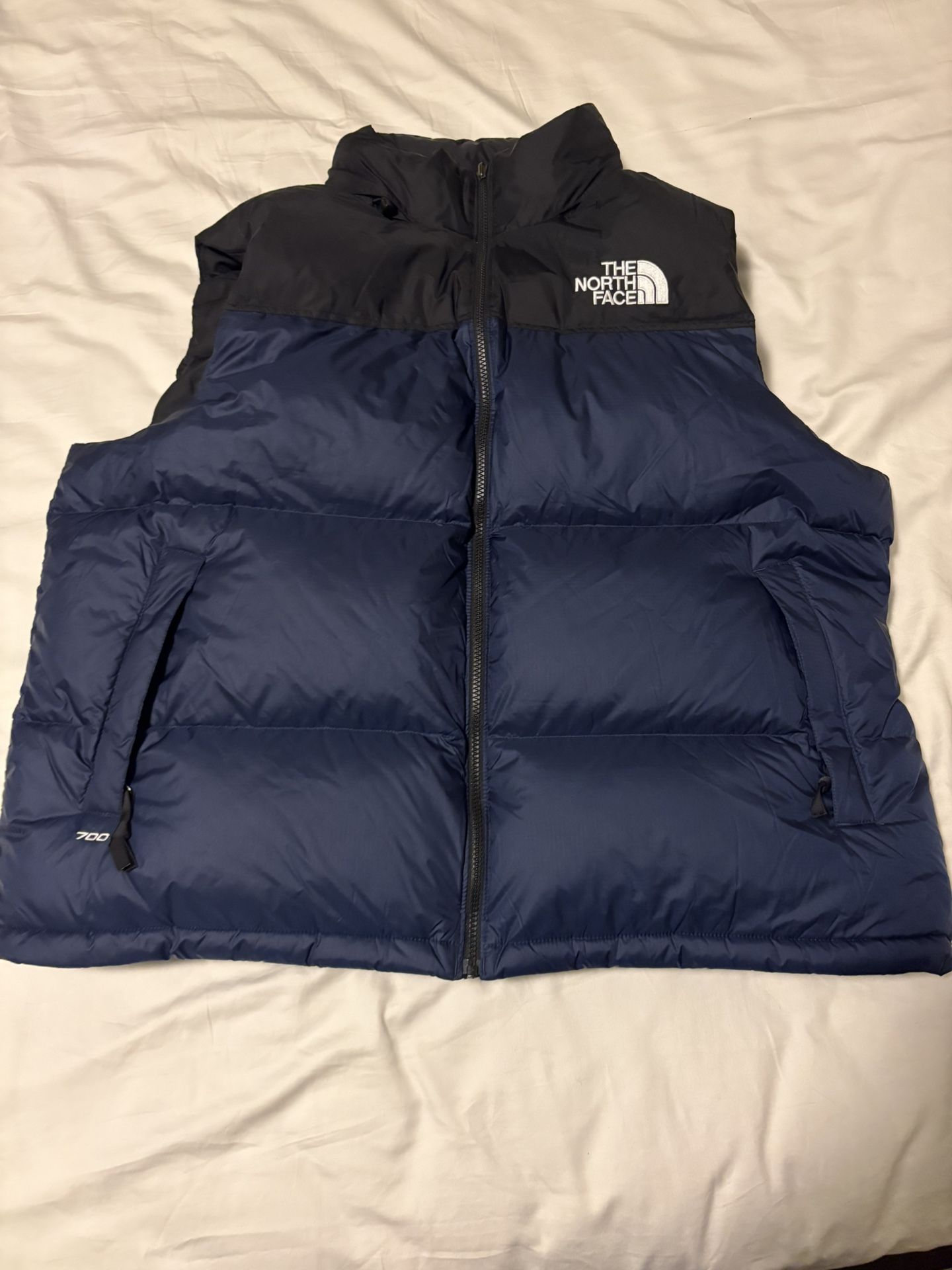 The North Face 1996 Retro Nuptse Vest in the color "Estate Blue/TNF Black"