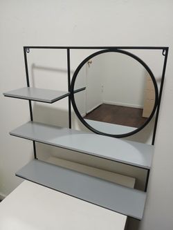 Wall metal rack with shelves and mirror
