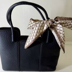 Compact Black Handbag with Decorative Scarf Accent