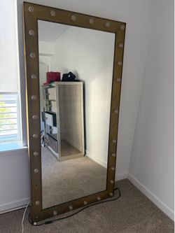 Restoration hardware illuminated mirror