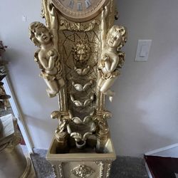 Very  Beautiful fountain a statue And  O’clock