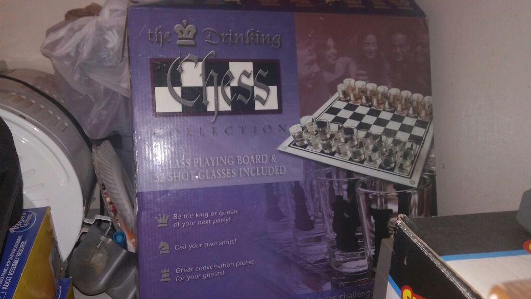 The drinkin chess collection. Glass playing board. 32 shot glasses